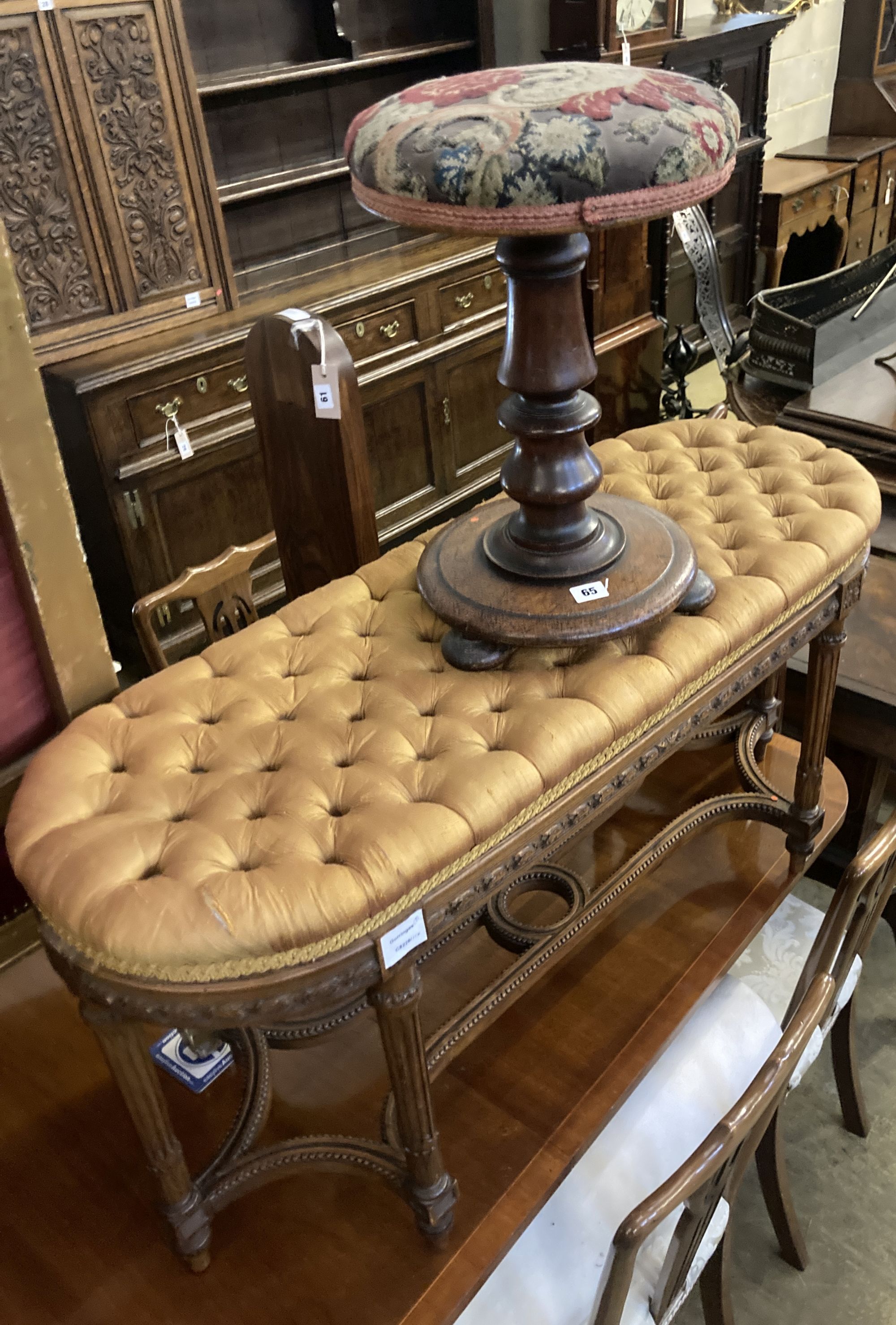 A French dressing stool, length 100cm, depth 38cm, height 52cm together with a Victorian adjustable piano stool